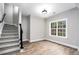 Finished basement room with wood-look flooring and large window at 114 Arborwood Way, Temple, GA 30179