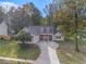 House exterior with a two-car garage and landscaping at 114 Arborwood Way, Temple, GA 30179