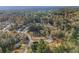 Aerial view of homes and wooded areas in a residential neighborhood at 114 Arborwood Way, Temple, GA 30179