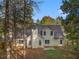 Back of house with large backyard and tree coverage at 114 Arborwood Way, Temple, GA 30179