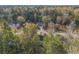 Aerial view of a quiet residential neighborhood with tree-lined streets at 114 Arborwood Way, Temple, GA 30179