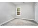 Simple bedroom with grey walls, carpet, and a window at 114 Arborwood Way, Temple, GA 30179