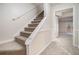 Carpeted stairs leading to lower level at 7004 Pat Mell Se Pl, Smyrna, GA 30080