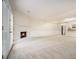Open living room with fireplace and kitchen access at 7004 Pat Mell Se Pl, Smyrna, GA 30080