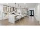 Modern kitchen with white cabinets, quartz countertops, and hardwood floors at 474 Haley Se St, Marietta, GA 30060