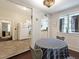 Cozy dining area with striped tablecloth and kitchen view at 1751 Marietta Nw Rd, Atlanta, GA 30318