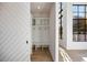 Modern entryway with built-in shelves, bench, and a sliding barn door at 247 Huntington Ne Rd, Atlanta, GA 30309