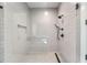 Walk-in shower with white subway tile, black fixtures, and a built-in bench at 247 Huntington Ne Rd, Atlanta, GA 30309