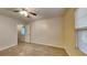 Spacious bedroom with ceiling fan and access to loft at 6043 Heisler St, Rex, GA 30273