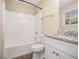 Updated bathroom with a shower/tub combo and granite vanity at 2887 Rockcliff Se Rd, Atlanta, GA 30316