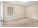 Well-lit bedroom with neutral carpeting and a window with blinds at 2887 Rockcliff Se Rd, Atlanta, GA 30316