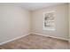 Charming bedroom with neutral carpeting and a large window at 2887 Rockcliff Se Rd, Atlanta, GA 30316