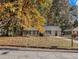 Newly painted house with fall leaves in the yard at 2887 Rockcliff Se Rd, Atlanta, GA 30316