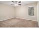 Bright bedroom with neutral carpeting and ceiling fan at 2887 Rockcliff Se Rd, Atlanta, GA 30316