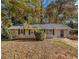 Newly painted house with fall leaves and trees at 2887 Rockcliff Se Rd, Atlanta, GA 30316