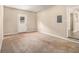 Spacious living room with neutral carpeting and an exterior door at 2887 Rockcliff Se Rd, Atlanta, GA 30316