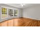 Bedroom with hardwood floors and bay windows at 1301 Witham Dr, Dunwoody, GA 30338