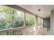 Relaxing screened porch overlooking a wooded area at 12 Rumson Ct, Smyrna, GA 30080