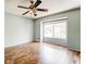 Spacious bedroom with hardwood floors and ceiling fan at 12 Rumson Ct, Smyrna, GA 30080