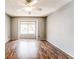 Bright bedroom with hardwood floors and large window at 12 Rumson Ct, Smyrna, GA 30080