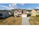 An aerial view of the two-story home with a large yard and attached garage at 138 Brookhaven Dr, Villa Rica, GA 30180