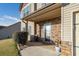 Front porch with stone accents, front door, and seating area at 138 Brookhaven Dr, Villa Rica, GA 30180