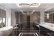 Elegant bathroom with marble finishes and a soaking tub at 2251 Old Atlanta Rd, Cumming, GA 30041