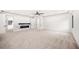 Spacious bedroom with plush carpet, fireplace, and high ceilings at 2251 Old Atlanta Rd, Cumming, GA 30041