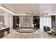 Luxurious bedroom featuring a large bed and marble wall at 2251 Old Atlanta Rd, Cumming, GA 30041