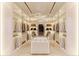 Large walk-in closet with ample storage space and island at 2251 Old Atlanta Rd, Cumming, GA 30041