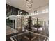 Grand entryway with marble floors, a curved staircase, and a wine cellar at 2251 Old Atlanta Rd, Cumming, GA 30041