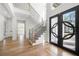 Elegant entryway with hardwood floors and modern staircase at 2251 Old Atlanta Rd, Cumming, GA 30041