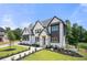 Stunning two-story home with white brick exterior and landscaped yard at 2251 Old Atlanta Rd, Cumming, GA 30041
