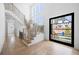 Spacious foyer with hardwood floors, a grand staircase, and large windows at 2251 Old Atlanta Rd, Cumming, GA 30041