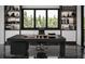 Luxurious home office with built-in shelving and large windows at 2251 Old Atlanta Rd, Cumming, GA 30041