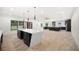 Large kitchen with an island and dark cabinetry at 2251 Old Atlanta Rd, Cumming, GA 30041