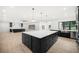 Spacious kitchen with island, stainless steel appliances, and dark cabinetry at 2251 Old Atlanta Rd, Cumming, GA 30041