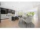 Modern kitchen with an island, breakfast area, and stainless steel appliances at 2251 Old Atlanta Rd, Cumming, GA 30041
