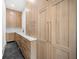 Bright laundry room with ample cabinetry and hexagon tile floor at 2251 Old Atlanta Rd, Cumming, GA 30041