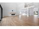Two-story living room with hardwood floors, fireplace, and high ceilings at 2251 Old Atlanta Rd, Cumming, GA 30041