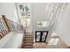 Grand staircase with modern railing and chandelier at 2251 Old Atlanta Rd, Cumming, GA 30041