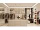 Bright walk-in closet with ample storage and island at 2251 Old Atlanta Rd, Cumming, GA 30041