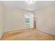 Empty bedroom with wood flooring and a window at 141 Denna Dr, Alpharetta, GA 30009