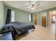 Comfortable bedroom with green walls, hardwood floors and ceiling fan at 4283 Michelle Ct, Loganville, GA 30052