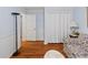 Bright living room with hardwood floors and built in shelving at 1055 Cranberry Crk, Roswell, GA 30076