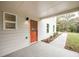 Covered side entrance with orange door and walkway at 844 Ridge Nw Ave, Atlanta, GA 30318