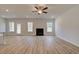 Spacious Gathering room with hardwood floors, fireplace, and multiple windows at 156 Buffalo Trce, Stockbridge, GA 30281