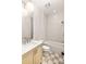 Clean bathroom with white subway tile and checkered floor at 1180 Lupo Loop, Chattahoochee Hills, GA 30268