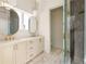 Elegant bathroom with double vanity, marble floors, and a glass shower at 1180 Lupo Loop, Chattahoochee Hills, GA 30268