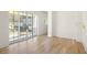 Bedroom with hardwood floors and private balcony at 1180 Lupo Loop, Chattahoochee Hills, GA 30268